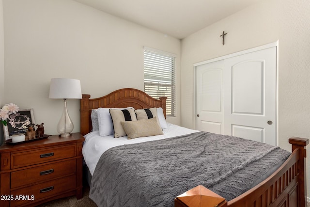 bedroom with carpet and a closet