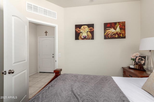 bedroom with light tile patterned floors