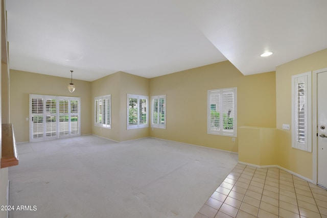 spare room featuring light tile patterned flooring