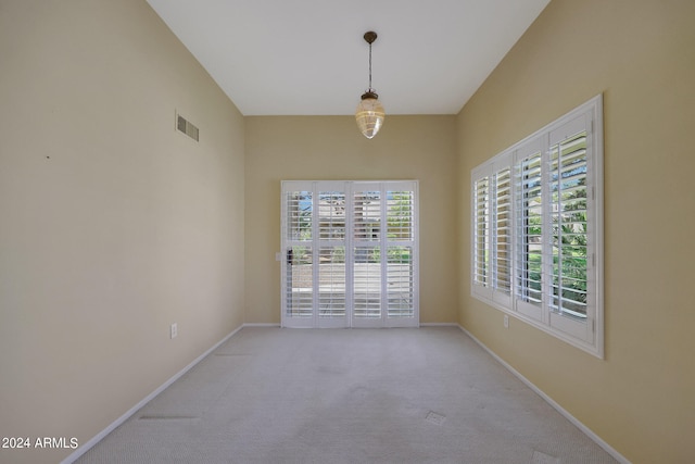 unfurnished room with light colored carpet