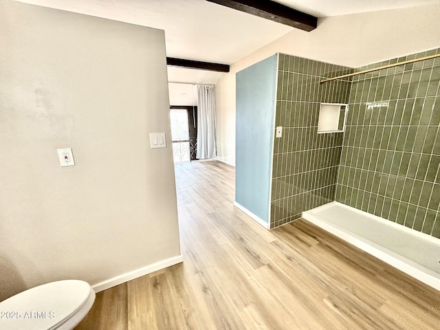 1705 E 6th St, Douglas, AZ 85607 - bathroom with baseboards, a tile shower, wood finished floors, and toilet