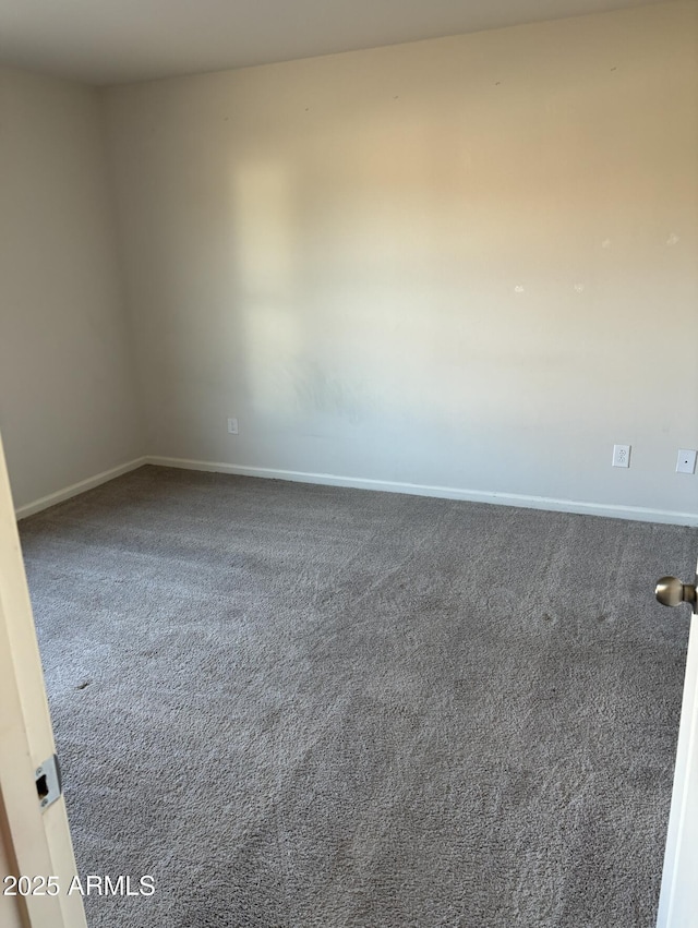 unfurnished room featuring carpet flooring