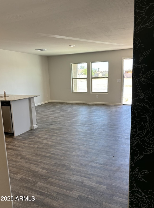 unfurnished room featuring dark hardwood / wood-style flooring