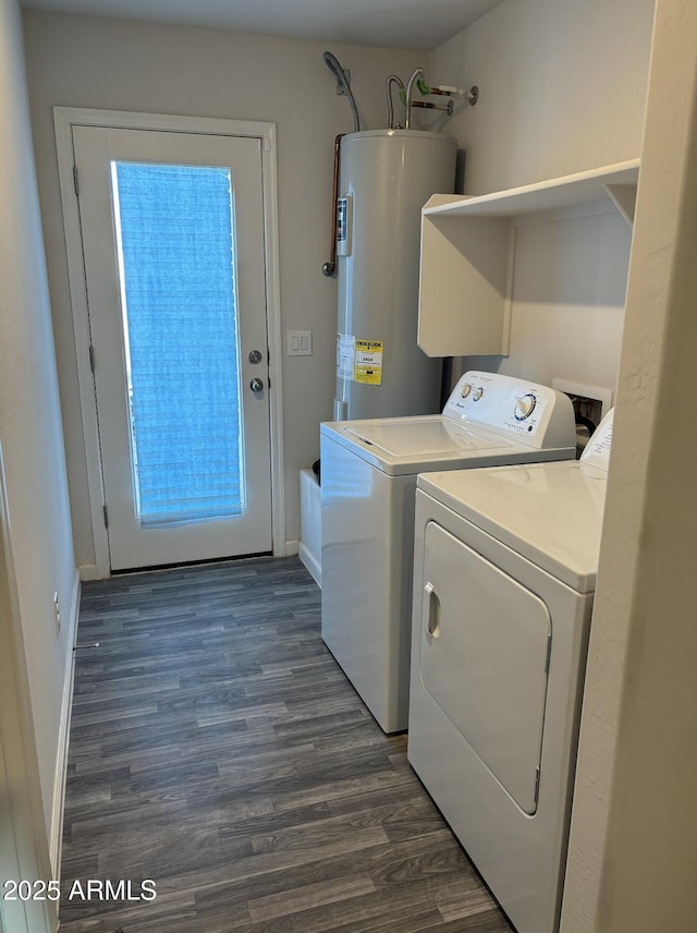 laundry room with washing machine and dryer, dark hardwood / wood-style floors, and water heater