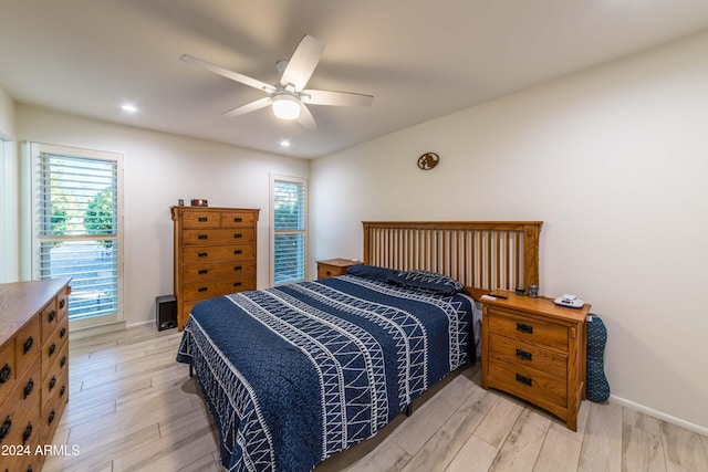 bedroom featuring light hardwood / wood-style flooring and ceiling fan