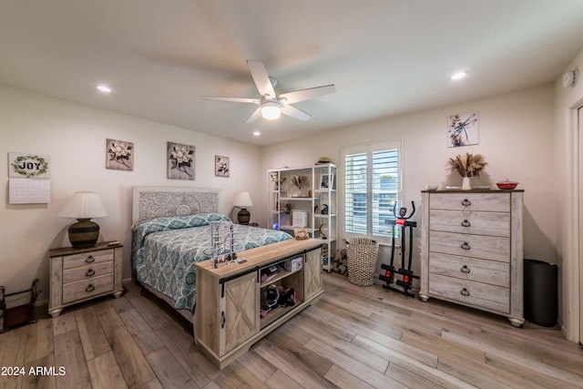 bedroom featuring ceiling fan and light hardwood / wood-style flooring