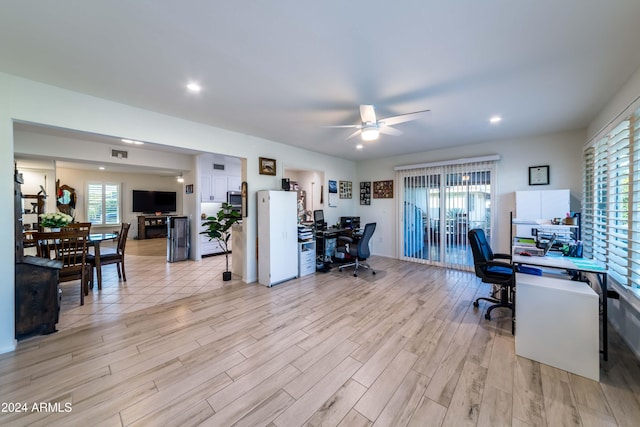 office space featuring ceiling fan and light hardwood / wood-style flooring