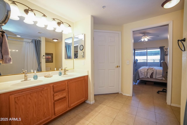 bathroom featuring ceiling fan, tile patterned flooring, and vanity