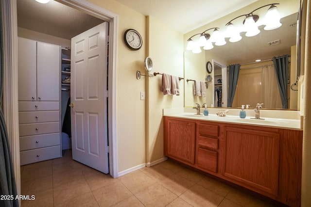 bathroom featuring vanity and tile patterned flooring