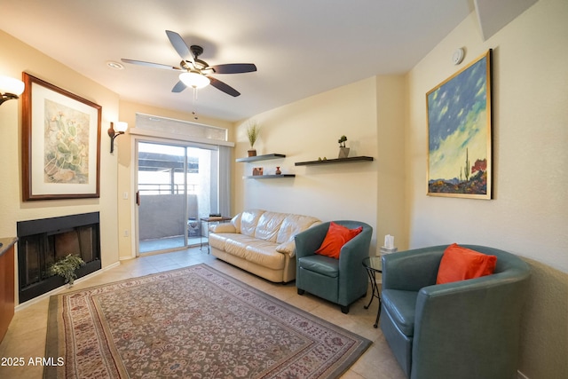 living room with ceiling fan and light tile patterned floors