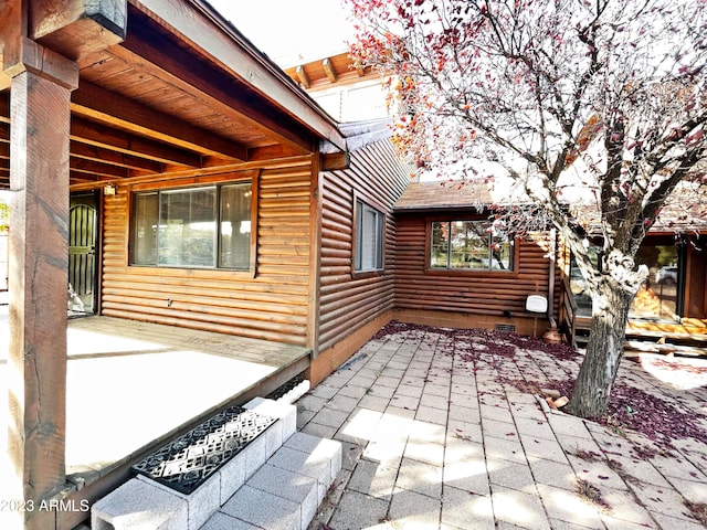 view of side of home featuring a patio