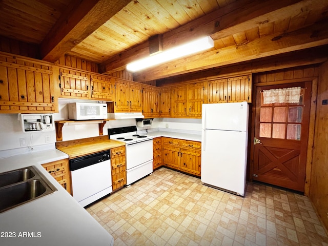 kitchen featuring white appliances, sink, light tile floors, beam ceiling, and wooden ceiling