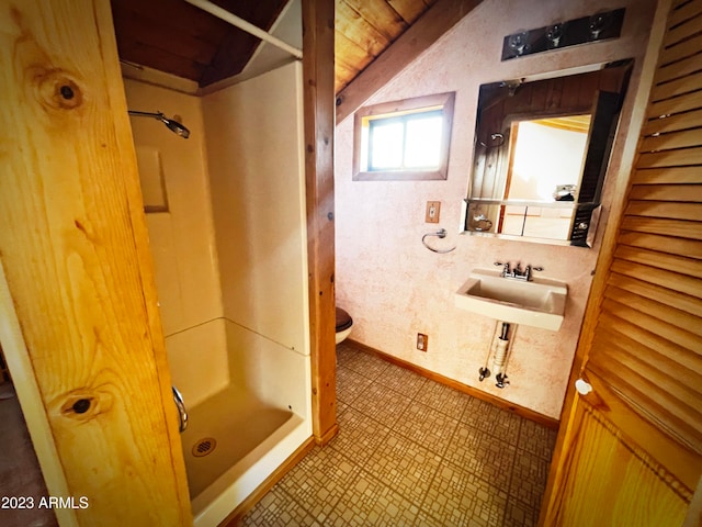 bathroom featuring toilet, tile floors, and sink