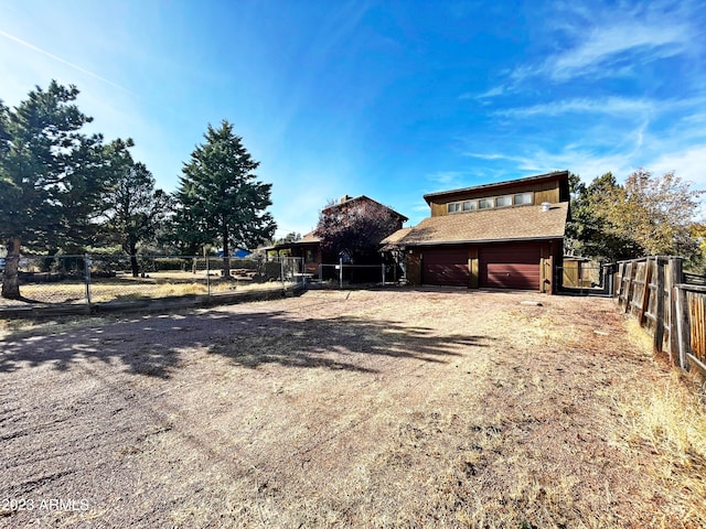 view of yard featuring a garage