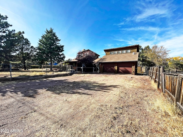 view of yard with a garage