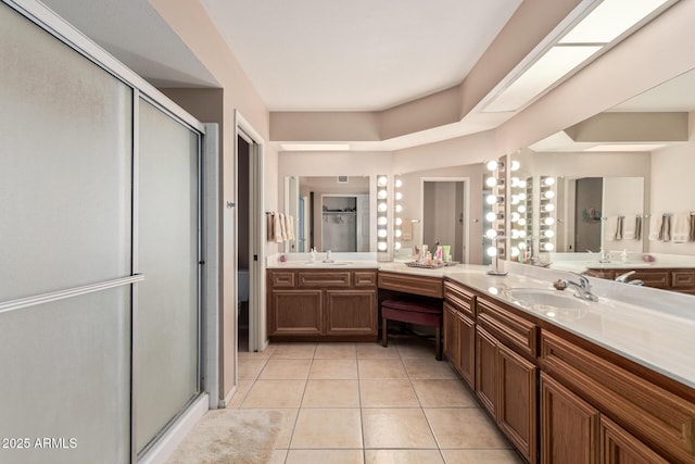bathroom featuring a shower stall, tile patterned flooring, and vanity
