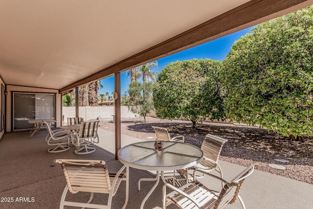 view of patio with a fenced backyard and outdoor dining space