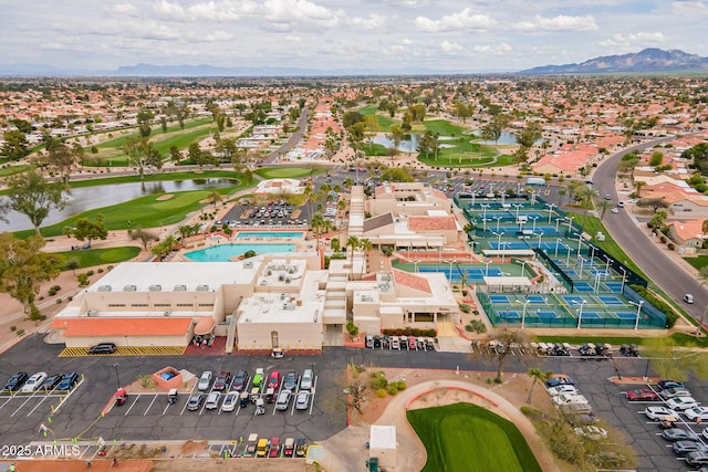 aerial view featuring a mountain view and view of golf course