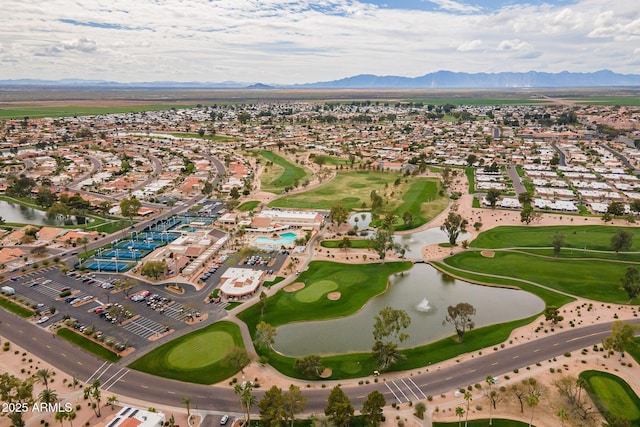 bird's eye view with golf course view and a water and mountain view