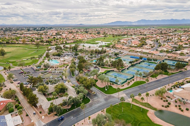 bird's eye view featuring golf course view, a mountain view, and a residential view