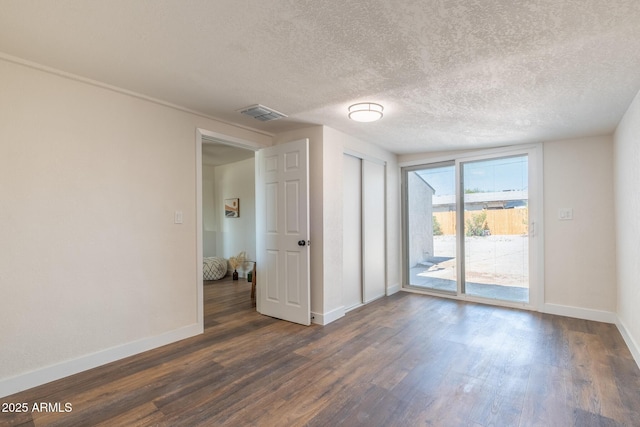 826 S Drew St, Mesa, AZ 85210 - spare room featuring dark wood-style floors and a textured ceiling