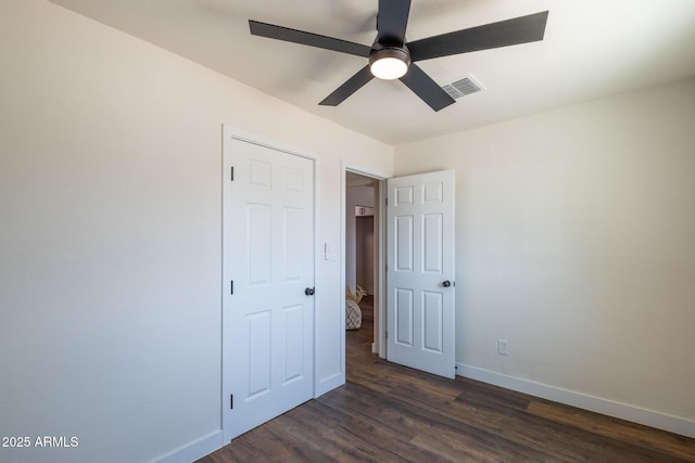 826 S Drew St, Mesa, AZ 85210 - unfurnished bedroom with dark wood-style floors and ceiling fan