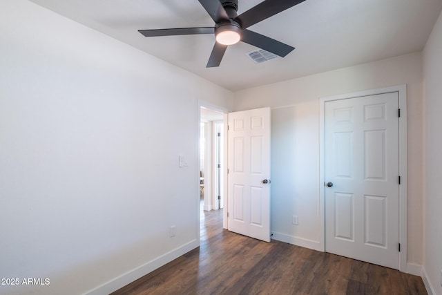 826 S Drew St, Mesa, AZ 85210 - unfurnished bedroom with dark wood-style flooring and ceiling fan