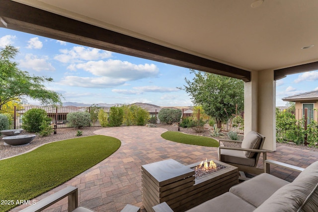 3266 Sparrows Creek Way, Wickenburg, AZ 85390 - view of patio / terrace featuring a fenced backyard and an outdoor living space with a fire pit