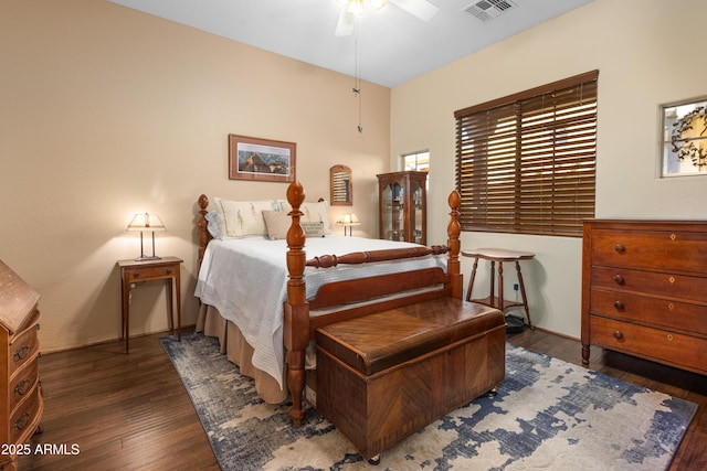 bedroom with visible vents, wood-type flooring, and ceiling fan