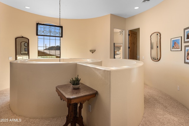 hall with visible vents, recessed lighting, and carpet