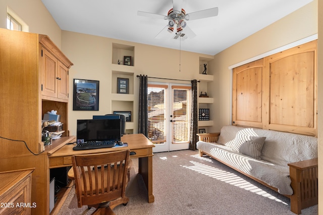 carpeted home office with visible vents, a ceiling fan, and french doors