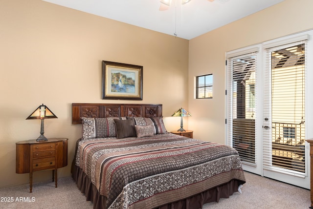 bedroom with access to exterior, light colored carpet, and ceiling fan