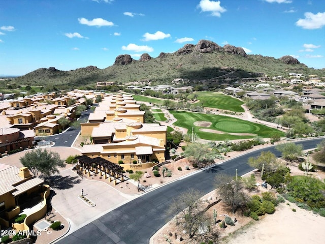 birds eye view of property with golf course view, a mountain view, and a residential view