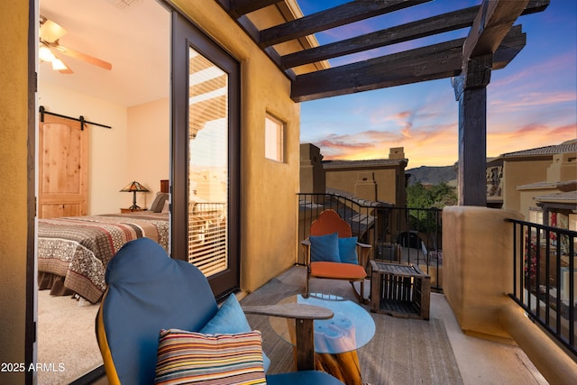 balcony at dusk with a pergola