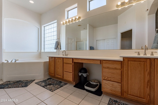 bathroom with vanity, independent shower and bath, and tile patterned floors