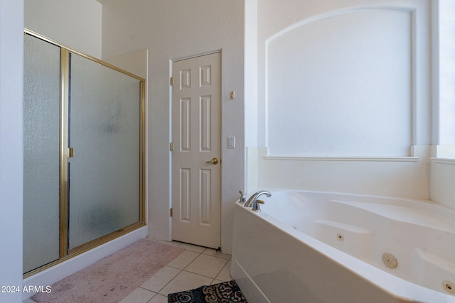 bathroom with tile patterned flooring and plus walk in shower