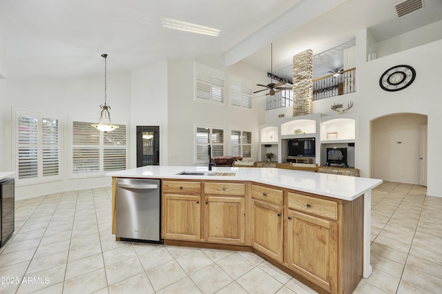 kitchen with ceiling fan, visible vents, stainless steel dishwasher, a sink, and light tile patterned floors