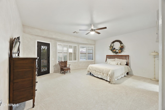 bedroom featuring carpet floors, ceiling fan, and visible vents
