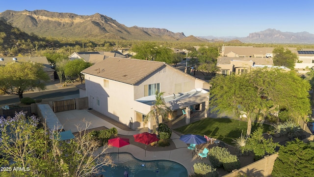 drone / aerial view featuring a residential view and a mountain view