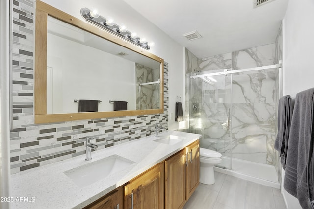 bathroom with visible vents, a sink, a marble finish shower, and tasteful backsplash