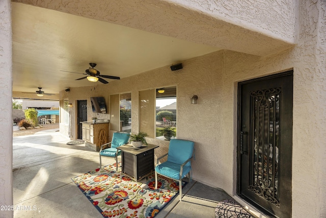view of patio featuring a ceiling fan