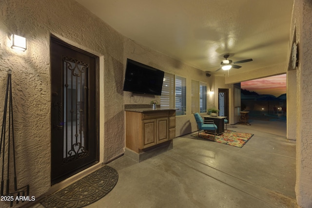 view of patio / terrace with a ceiling fan