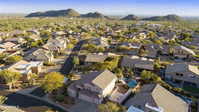 drone / aerial view featuring a residential view and a mountain view