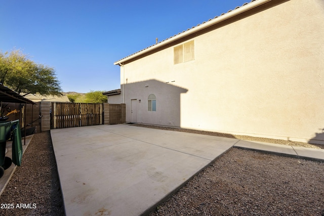 exterior space with fence and a gate
