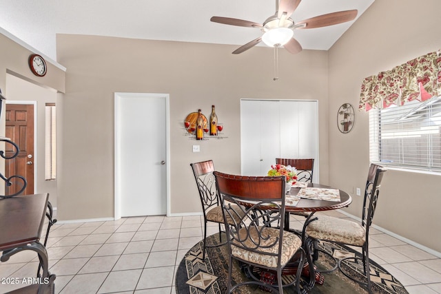 dining room featuring light tile patterned floors and ceiling fan