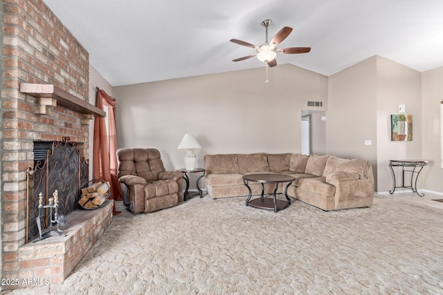 living room featuring lofted ceiling, a brick fireplace, carpet floors, and ceiling fan