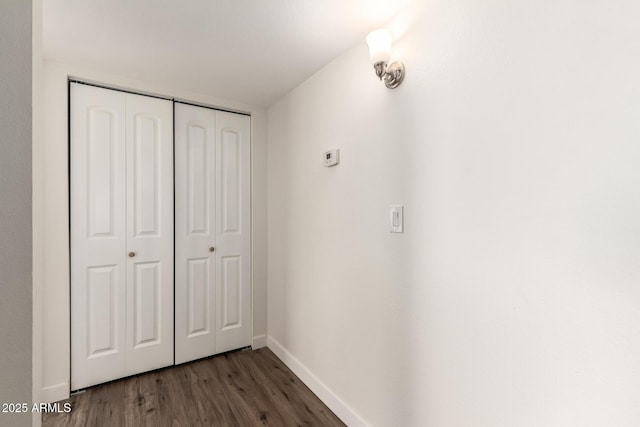 hall with dark hardwood / wood-style floors