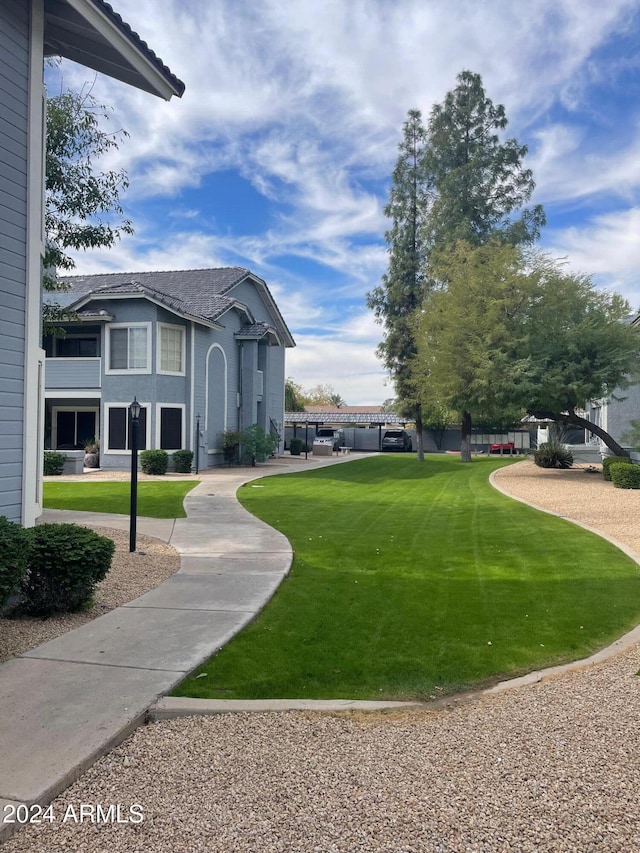 surrounding community with a lawn