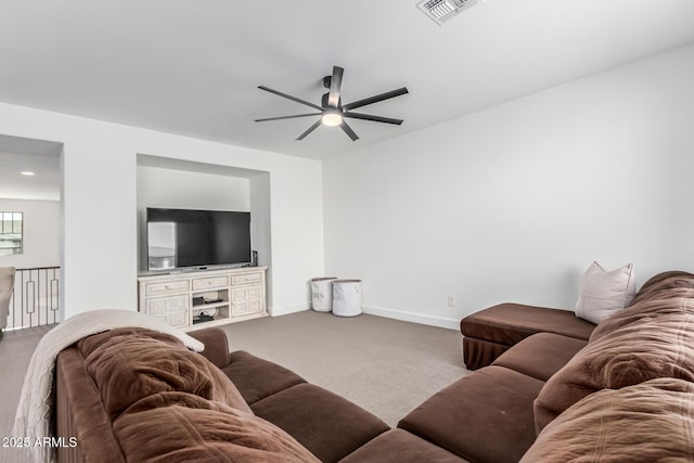 living room featuring a ceiling fan, carpet flooring, visible vents, and baseboards