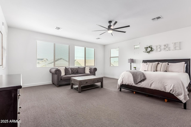 bedroom featuring carpet floors, visible vents, and baseboards